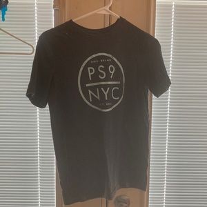 Save room in my closet. It’s a dark gray t-shirt with light blue design